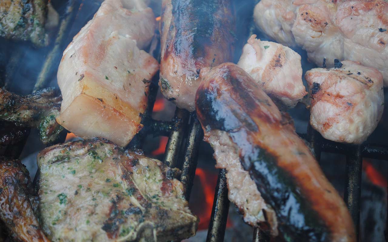 Quality sausages and burgers sizzling on the BBQ